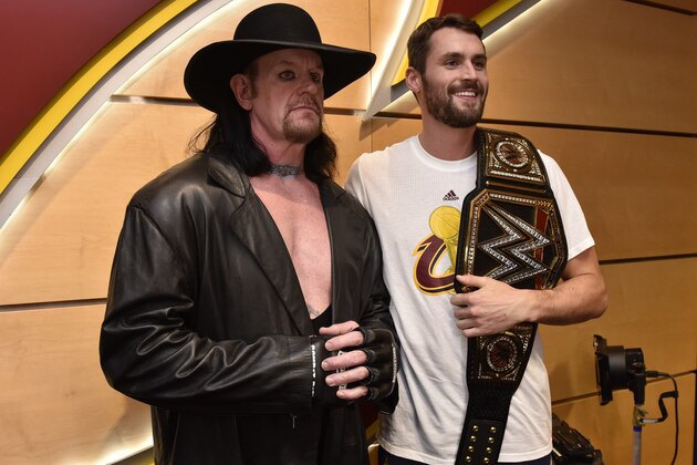 CLEVELAND, OH - OCTOBER 25:  WWE Wrestler, The Undertaker poses for a photo with Kevin Love #0 of the Cleveland Cavaliers before the game against the New York Knicks on October 25, 2016 at Quicken Loans Arena in Cleveland, Ohio. NOTE TO USER: User expressly acknowledges and agrees that, by downloading and or using this photograph, user is consenting to the terms and conditions of the Getty Images License Agreement. Mandatory Copyright Notice: Copyright 2016 NBAE (Photo by David Liam Kyle/NBAE via Getty Images)