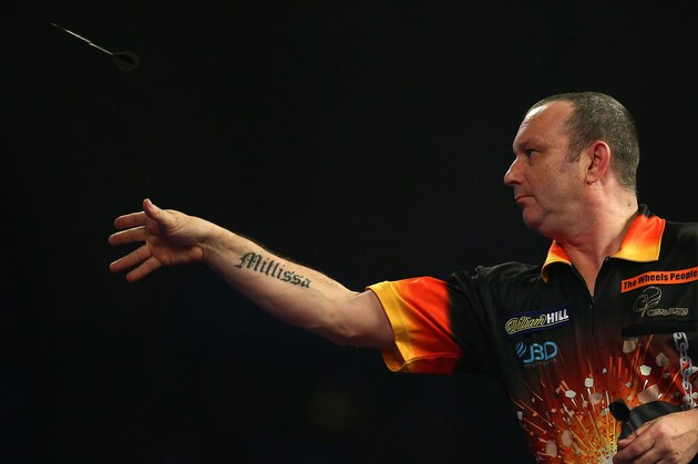 LONDON, ENGLAND - DECEMBER 27: Darren Webster of England action during his second round match against Michael van Gerwen of Holland during the 2016 William Hill PDC World Darts Championships on Day Nine at Alexandra Palace on December 27, 2015 in London, England. (Photo by Charlie Crowhurst/Getty Images)