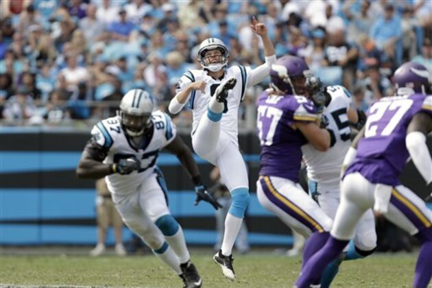 Carolina Panthers' Andy Lee (8) watches his punt sail over to the Minnesota Vikings during the second half of an NFL football game in Charlotte, N.C., Sunday, Sept. 18, 2016. The Vikings won 22-10. (AP Photo/Bob Leverone)