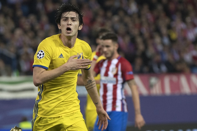Rostov's Iranian forward Sardar Azmoun celebrates after scoring during the UEFA Champions League Group D football match Club Atletico de Madrid vs FC Rostov at the Vicente Calderon stadium in Madrid, on November 1, 2016. / AFP / CURTO DE LA TORRE        (Photo credit should read CURTO DE LA TORRE/AFP/Getty Images)