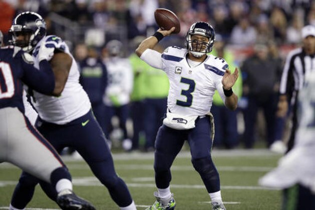 Seattle Seahawks quarterback Russell Wilson passes against the New England Patriots during the first half of an NFL football game, Sunday, Nov. 13, 2016, in Foxborough, Mass. (AP Photo/Charles Krupa)