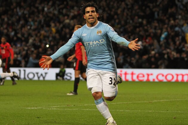 MANCHESTER, ENGLAND - JANUARY 19:  Carlos Tevez of Manchester City celebrates scoring his team's first goal during the Carling Cup Semi Final match between Manchester City and Manchester United at the City of Manchester Stadium on January 19, 2010 in Manchester, England.  (Photo by Alex Livesey/Getty Images)