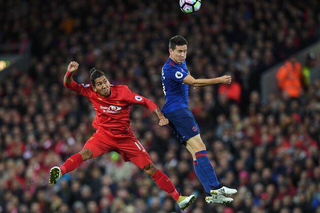 TOPSHOT - Manchester United's Spanish midfielder Ander Herrera (R) vies with Liverpool's Brazilian midfielder Roberto Firmino during the English Premier League football match between Liverpool and Manchester United at Anfield in Liverpool, north west England on October 17, 2016. / AFP / Paul ELLIS / RESTRICTED TO EDITORIAL USE. No use with unauthorized audio, video, data, fixture lists, club/league logos or 'live' services. Online in-match use limited to 75 images, no video emulation. No use in betting, games or single club/league/player publications. / (Photo credit should read PAUL ELLIS/AFP/Getty Images) TOPSHOT - Manchester United's Spanish midfielder Ander Herrera (R) vies with Liverpool's Brazilian midfielder Roberto Firmino during the English Premier League football match between Liverpool and Manchester United at Anfield in Liverpool, north west England on October 17, 2016. / AFP / Paul ELLIS / RESTRICTED TO EDITORIAL USE. No use with unauthorized audio, video, data, fixture lists, club/league logos or 'live' services. Online in-match use limited to 75 images, no video emulation. No use in betting, games or single club/league/player publications. / (Photo credit should read PAUL ELLIS/AFP/Getty Images)