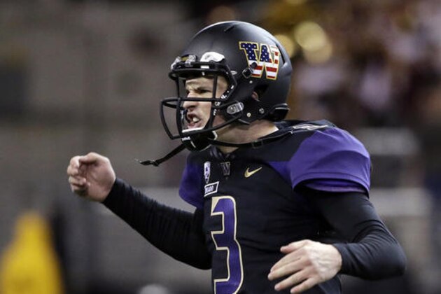 Washington quarterback Jake Browning reacts after throwing a touchdown pass against Southern California in the second half of an NCAA college football game Saturday, Nov. 12, 2016, in Seattle. USC won 26-13. (AP Photo/Elaine Thompson)