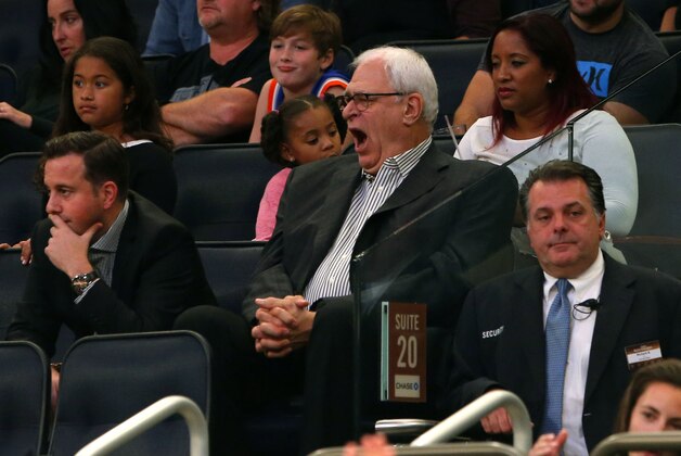 Oct 16, 2015; New York, NY, USA;  New York Knicks general manager Phil Jackson yawns watching the Knicks play the Boston Celtics during second half at Madison Square Garden. Mandatory Credit: Noah K. Murray-USA TODAY Sports