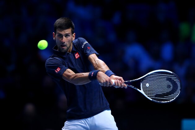 LONDON, ENGLAND - NOVEMBER 13:  Novak Djokovic of Serbia hits a backhand during his men's singles match against Dominic Thiem of Austria on day one of the ATP World Tour Finals at O2 Arena on November 13, 2016 in London, England.  (Photo by Clive Brunskill/Getty Images)