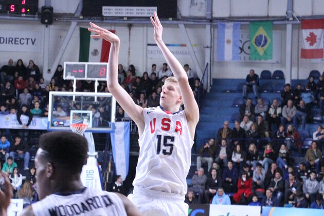 The 7'3" Connor Vanover puts up a jump shot with USA Basketball.