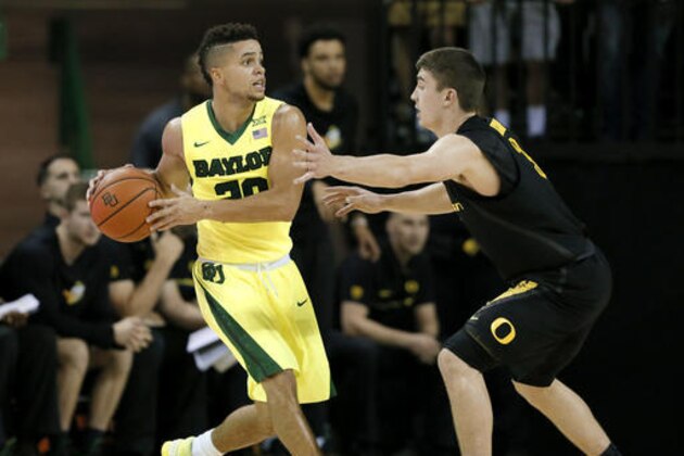 Baylor guard Manu Lecomte (20) looks to pass the ball under pressure from Oregon's Payton Pritchard, right, in the first half of an NCAA college basketball game, Tuesday Nov. 15, 2016, in Waco, Texas. (AP Photo/Tony Gutierrez)
