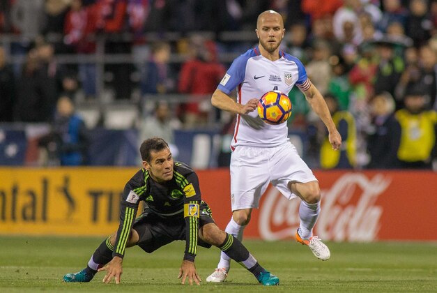 Nov 11, 2016; Columbus, OH, USA;  USA midfielder Michael Bradley (4) wins a ball over Mexico defender Rafael Marquez (4) during the first half of the match at MAPFRE Stadium. Mexico beats the USA 2-1. Mandatory Credit: Trevor Ruszkowski-USA TODAY Sports