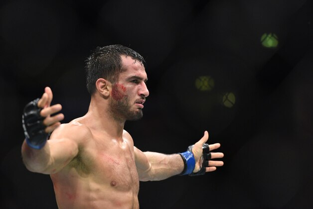 Oct 8, 2016; Manchester, UK; Gegard Mousasi (blue gloves) celebrates his victory over Vitor Belfort during UFC 204 at Manchester Arena. Mandatory Credit: Per Haljestam-USA TODAY Sports