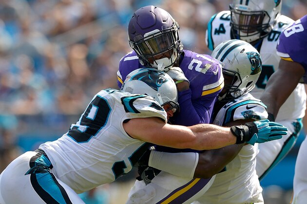 CHARLOTTE, NC - SEPTEMBER 25:  Luke Kuechly #59 of the Carolina Panthers tackles Jerick McKinnon #21 of the Minnesota Vikings in the 3rd quarter during the game at Bank of America Stadium on September 25, 2016 in Charlotte, North Carolina.  (Photo by Grant Halverson/Getty Images)