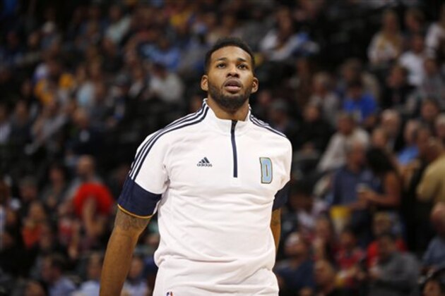 Denver Nuggets forward Alonzo Gee warms up before facing the Chicago Bulls in the third quarter of the Nuggets' 114-109 victory in an NBA basketball game in Denver on Tuesday, Nov. 25, 2014. (AP Photo/David Zalubowski)
