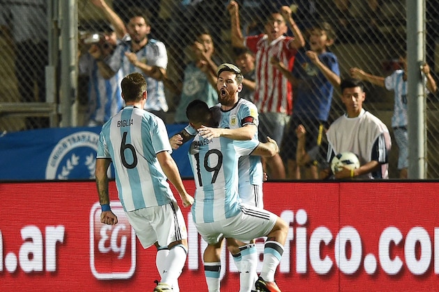 Argentina's Lionel Messi (R) celebrates with teammates after scoring against Colombia during their 2018 FIFA World Cup qualifier football match in San Juan, Argentina, on November 15, 2016. / AFP / EITAN ABRAMOVICH        (Photo credit should read EITAN ABRAMOVICH/AFP/Getty Images)