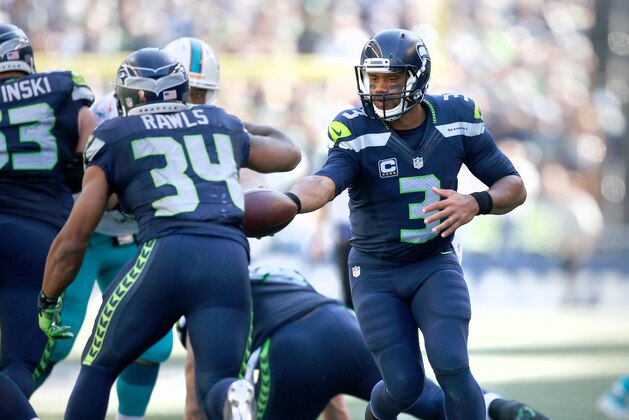 SEATTLE, WA - SEPTEMBER 11:  Quarterback Russell Wilson #3 of the Seattle Seahawks hands off the ball to running back Thomas Rawls #34 against the Miami Dolphins in the second half at CenturyLink Field on September 11, 2016 in Seattle, Washington.  (Photo by Otto Greule Jr/Getty Images)