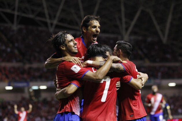 Costa Rica's Christian Bolanos is congratulated by teammates after scoring against United States during a 2018 World Cup qualifying soccer match in San Jose, Costa Rica, Tuesday, Nov. 15, 2016. (AP Photo/Moises Castillo)