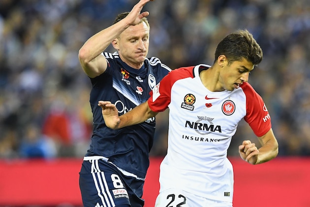 MELBOURNE, AUSTRALIA - NOVEMBER 12:  Besart Berisha of the Victory and Jonathan Aspropotamitis of the Wanderers compete for the ball during the round six A-League match between the Melbourne Victory and the Western Sydney Wanderers at Etihad Stadium on November 12, 2016 in Melbourne, Australia.  (Photo by Quinn Rooney/Getty Images)