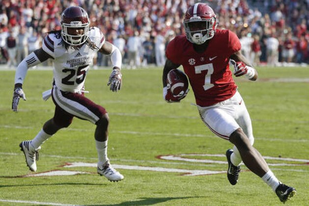 Alabama wide receiver Trevon Diggs runs into for a touchdown against Mississippi State defensive back Lashard Durr during the second half of an NCAA college football game, Saturday, Nov. 12, 2016, in Tuscaloosa, Ala. (AP Photo/Brynn Anderson)