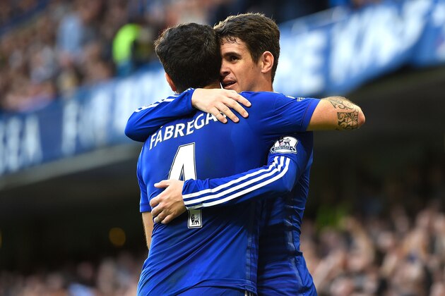 LONDON, ENGLAND - NOVEMBER 01:  Oscar of Chelsea celebrates his goal with Cesc Fabregas during the Barclays Premier League match between Chelsea and Queens Park Rangers at Stamford Bridge on November 1, 2014 in London, England.  (Photo by Mike Hewitt/Getty Images)