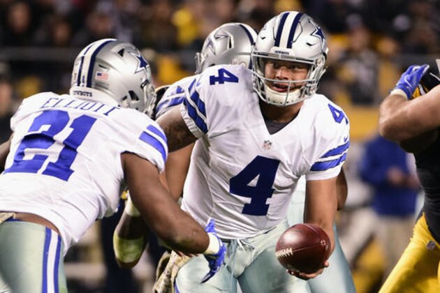 Dallas Cowboys quarterback Dak Prescott (4) hands off the Ezekiel Elliott (21) during the second half of an NFL football game against the Pittsburgh Steelers in Pittsburgh, Sunday, Nov. 13, 2016. (AP Photo/Fred Vuich)