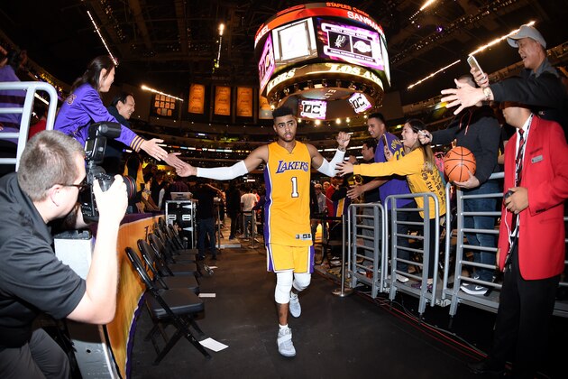 LOS ANGELES, CA -NOVEMBER 15: D'Angelo Russell #1 of the Los Angeles Lakers high fives fans as he heads to the locker room after the game against the Brooklyn Nets on November 15, 2016 at STAPLES Center in Los Angeles, California. NOTE TO USER: User expressly acknowledges and agrees that, by downloading and/or using this Photograph, user is consenting to the terms and conditions of the Getty Images License Agreement. Mandatory Copyright Notice: Copyright 2016 NBAE (Photo by Andrew D. Bernstein/NBAE via Getty Images)