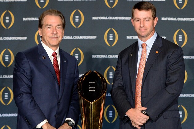 SCOTTSDALE, AZ - JANUARY 10:  Head coach Nick Saban of the Alabama Crimson Tide (L) and head coach Dabo Swinney of the Clemson Tigers pose for a photo next to the National Championship trophy during the Head Coach Press Conference for the College Football Playoff National Championship at JW Marriott Scottsdale Camelback Inn on January 10, 2016 in Scottsdale, Arizona.  (Photo by Jennifer Stewart/Getty Images)
