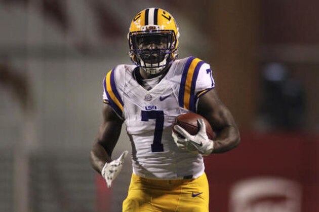 LSU's Leonard Fournette (7) rushes down the field during the first half of an NCAA college football game against Arkansas, Saturday, Nov. 12, 2016, in Fayetteville, Ark. (AP Photo/Samantha Baker)