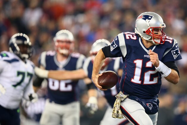 FOXBORO, MA - NOVEMBER 13: Tom Brady #12 of the New England Patriots carries the ball during the third quarter of a game against the Seattle Seahawks at Gillette Stadium on November 13, 2016 in Foxboro, Massachusetts. (Photo by Adam Glanzman/Getty Images)