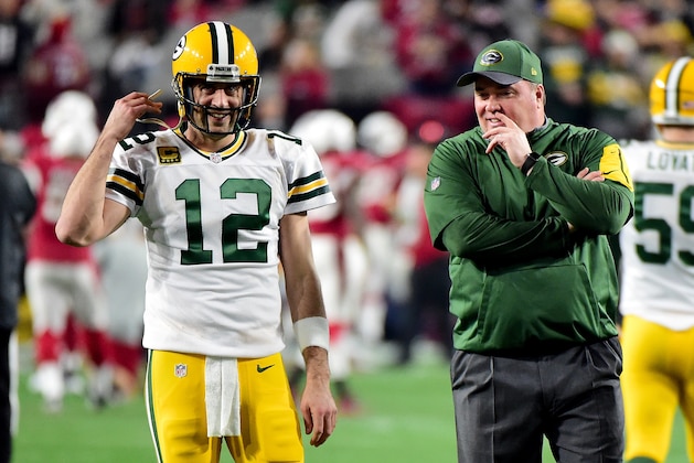 GLENDALE, AZ - JANUARY 16:  Quarterback Aaron Rodgers #12 talks with head coach Mike McCarthy of the Green Bay Packers looks on before taking on the Arizona Cardinals in the NFC Divisional Playoff Game at University of Phoenix Stadium on January 16, 2016 in Glendale, Arizona.  (Photo by Harry How/Getty Images)