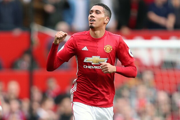 MANCHESTER, ENGLAND - SEPTEMBER 24: Chris Smalling of Manchester United celebrates after scoring a goal to make it 1-0 during the Premier League match between Manchester United and Leicester City at Old Trafford on September 24, 2016 in Manchester, England. (Photo by James Baylis - AMA/Getty Images)