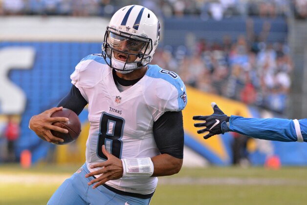 Nov 6, 2016; San Diego, CA, USA; Tennessee Titans quarterback Marcus Mariota (8) runs the ball for a touchdown during the second half of the game against the San Diego Chargers at Qualcomm Stadium. San Diego won 43-35. Mandatory Credit: Orlando Ramirez-USA TODAY Sports