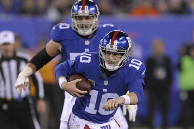 New York Giants quarterback Eli Manning (10) runs the ball against the Cincinnati Bengals during the second quarter of an NFL football game, Monday, Nov. 14, 2016, in East Rutherford, N.J. (AP Photo/Bill Kostroun)