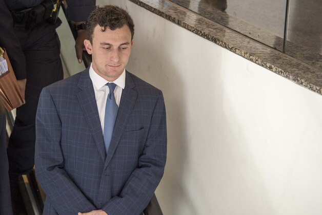 May 5, 2016; Dallas, TX, USA; Johnny Manziel leaves the courtroom after he makes his first appearance at the Frank Crowley Courts Building on his misdemeanor assault charge.  Mandatory Credit: Jerome Miron-USA TODAY Sports