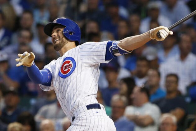 FILE - In this Aug. 31, 2016, file photo, Chicago Cubs' Kris Bryant follows through on a solo home run during the first inning of a baseball game against the Pittsburgh Pirates, in Chicago. Bryant, Bryce Harper and Big Papi are just a few of the big-name offensive stars leading their teams into the postseason. (AP Photo/Nam Y. Huh, File)