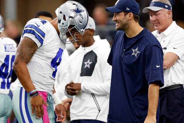 ARLINGTON, TX - OCTOBER 09:   (L-R) Dak Prescott #4, quarterback of the Dallas Cowboys talks with injured quarterback Tony Romo #8 prior to the game against the Cincinnati Bengals at AT&T Stadium on October 9, 2016 in Arlington, Texas. (Photo by Wesley Hitt/Getty Images)