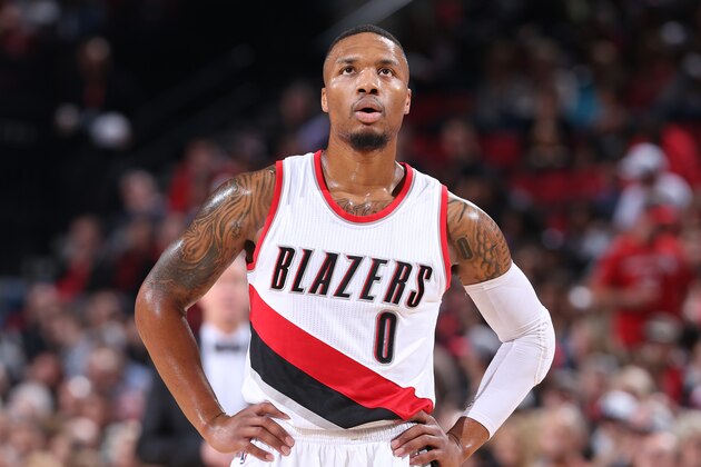 PORTLAND, OR - NOVEMBER 13: Damian Lillard #0 of the Portland Trail Blazers looks on during the game against the Denver Nuggets on November 13, 2016 at the Moda Center in Portland, Oregon. NOTE TO USER: User expressly acknowledges and agrees that, by downloading and or using this Photograph, user is consenting to the terms and conditions of the Getty Images License Agreement. Mandatory Copyright Notice: Copyright 2016 NBAE (Photo by Sam Forencich/NBAE via Getty Images)