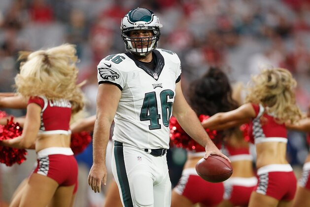 GLENDALE, AZ - OCTOBER 26:  Long snapper Jon Dorenbos #46 of the Philadelphia Eagles warms up on the field as the Arizona Cardinals cheerleaders perform before the NFL game at the University of Phoenix Stadium on October 26, 2014 in Glendale, Arizona.  (Photo by Christian Petersen/Getty Images)
