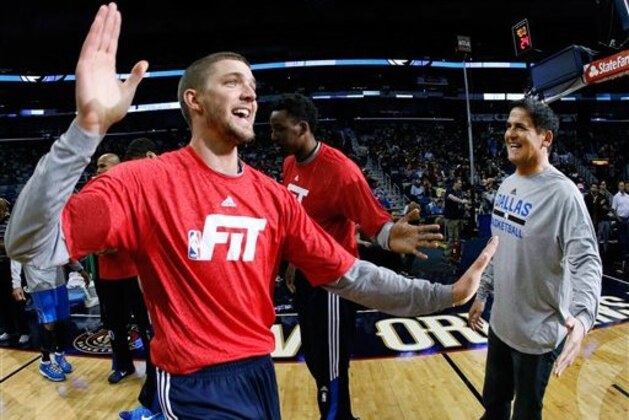 Dallas Mavericks forward Chandler Parsons high-fives owner Mark Cuban before an NBA basketball game, Sunday, Jan. 25, 2015, in New Orleans. (AP Photo/Jonathan Bachman)