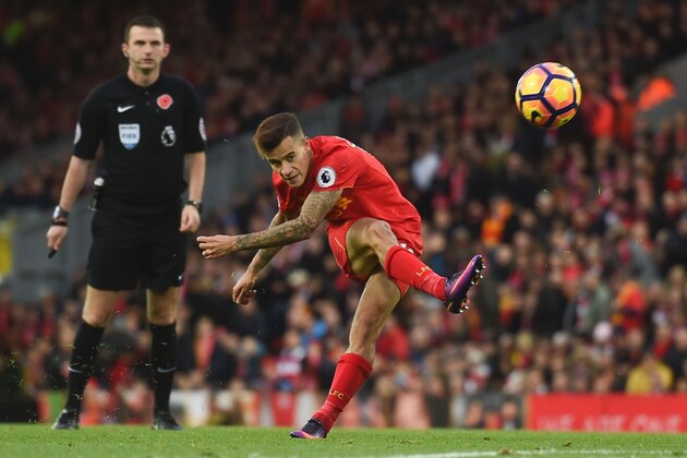 Liverpool's Brazilian midfielder Philippe Coutinho attempts a shot at goal during the English Premier League football match between Liverpool and Watford at Anfield in Liverpool, north west England on November 6, 2016. / AFP / PAUL ELLIS / RESTRICTED TO EDITORIAL USE. No use with unauthorized audio, video, data, fixture lists, club/league logos or 'live' services. Online in-match use limited to 75 images, no video emulation. No use in betting, games or single club/league/player publications.  /         (Photo credit should read PAUL ELLIS/AFP/Getty Images)