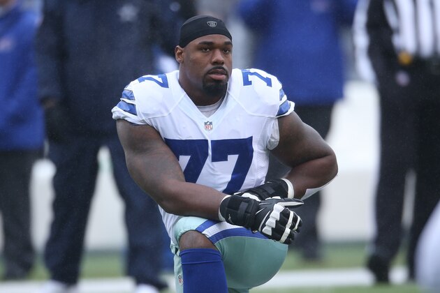 ORCHARD PARK, NY - DECEMBER 27: Tyron Smith #77 of the Dallas Cowboys warms up before the start of their game against the Buffalo Bills during NFL game action at Ralph Wilson Stadium on December 27, 2015 in Orchard Park, New York. (Photo by Tom Szczerbowski/Getty Images)