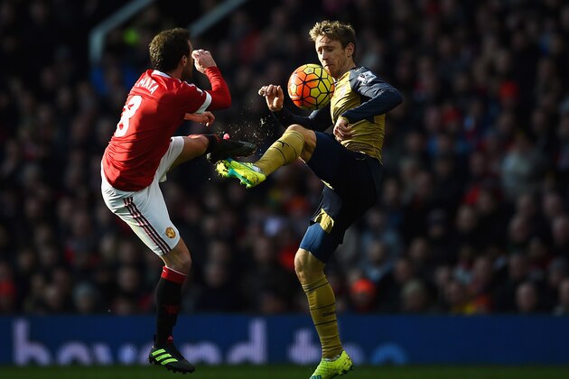 MANCHESTER, ENGLAND - FEBRUARY 28: Juan Mata of Manchester United challenges Nacho Monreal of Arsenal during the Barclays Premier League match between Manchester United and Arsenal at Old Trafford on February 28, 2016 in Manchester, England.  (Photo by Laurence Griffiths/Getty Images)