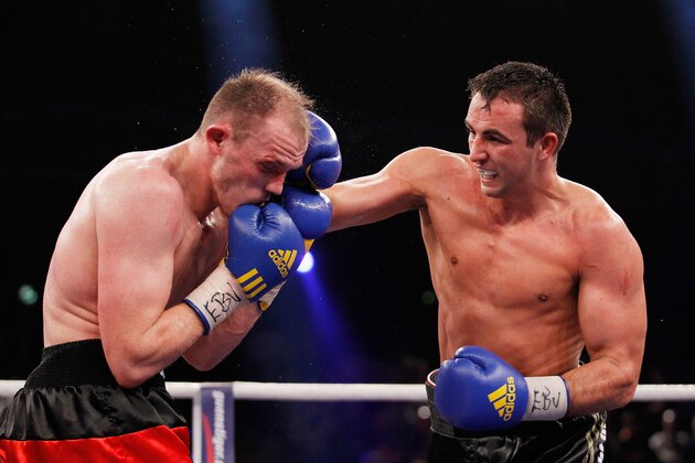 BERLIN, GERMANY - FEBRUARY 02:  Juergen Braehmer (L) of Germany and Eduard Gutknecht of Germany exchange punches during the WBO  European Championship Light Heavyweight title fight at Max-Schmeling Hall on February 2, 2013 in Berlin, Germany.  (Photo by Boris Streubel/Getty Images)