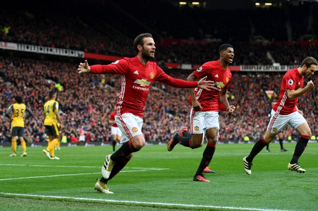 MANCHESTER, ENGLAND - NOVEMBER 19:  Juan Mata of Manchester United (L) celebrates scoring his sides first goal during the Premier League match between Manchester United and Arsenal at Old Trafford on November 19, 2016 in Manchester, England.  (Photo by Shaun Botterill/Getty Images)
