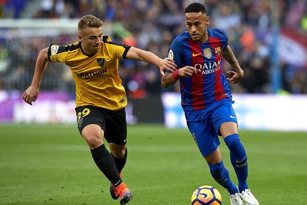 BARCELONA, SPAIN - NOVEMBER 19:  Neymar JR of Barcelona competes for the ball with Ontiveros (L) of Malaga during the La Liga match between FC Barcelona and Malaga CF at Camp Nou stadium on November 19, 2016 in Barcelona, Spain.  (Photo by Manuel Queimadelos Alonso/Getty Images)