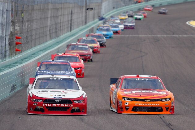 HOMESTEAD, FL - NOVEMBER 19:  Ryan Blaney, driver of the #22 Fleetwood/REV Group Ford, and Kyle Larson, driver of the #42 ENEOS Chevrolet, lead a pack of cars during the NASCAR XFINITY Series Ford EcoBoost 300 at Homestead-Miami Speedway on November 19, 2016 in Homestead, Florida.  (Photo by Chris Trotman/Getty Images)