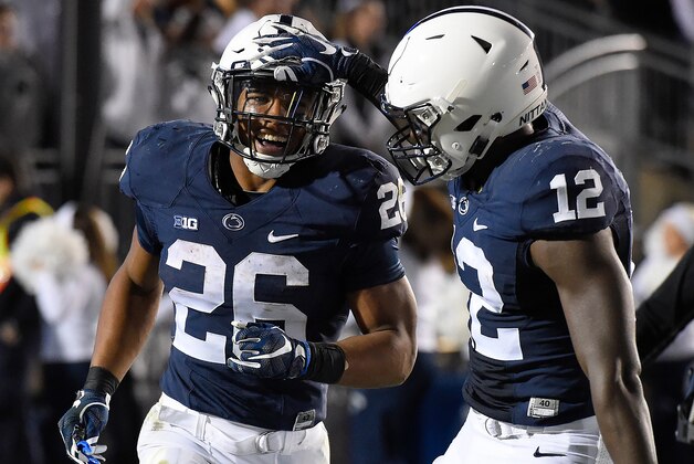 Nov 5, 2016; University Park, PA, USA; Penn State Nittany Lions running back Saquon Barkley (26) celebrates his touchdown with teammate wide receiver Chris Godwin (12) against the Iowa Hawkeyes during the fourth quarter at Beaver Stadium. Penn State defeated Iowa 41-14. Mandatory Credit: Rich Barnes-USA TODAY Sports