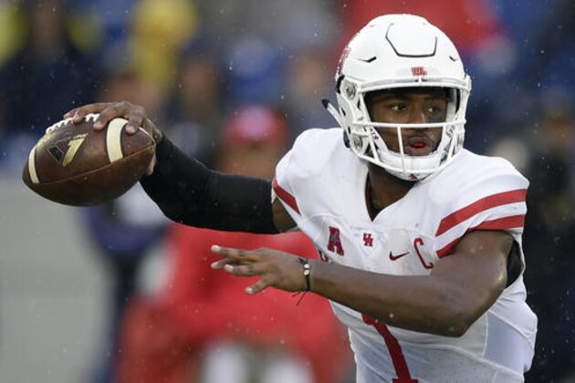 FILE - In this Oct. 8, 2016, file photo, Houston quarterback Greg Ward Jr. (1) looks to pass during the first half of an NCAA football game against Navy in Annapolis, Md. If Ward and the Cougars want to rekindle playoff hopes, they will need some convincing victories leading into a late-season nonconference showdown with Louisville. (AP Photo/Nick Wass, File)