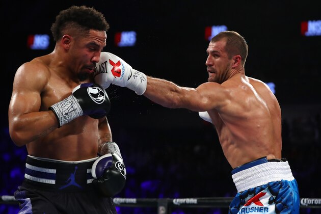 LAS VEGAS, NV - NOVEMBER 19:   (R-L) Sergey Kovalev of Russia lands a left to the head of Andre Ward during the second round of their light heavyweight title bout at T-Mobile Arena on November 19, 2016 in Las Vegas, Nevada.  (Photo by Al Bello/Getty Images)