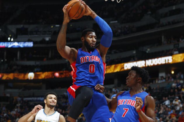 Detroit Pistons center Andre Drummond, center, pulls down a rebound in front of forward Stanley Johnson, right, and Denver Nuggets guard Jamal Murray in the second half of an NBA basketball game Saturday, Nov. 12, 2016, in Denver. The Pistons won 106-95. (AP Photo/David Zalubowski)