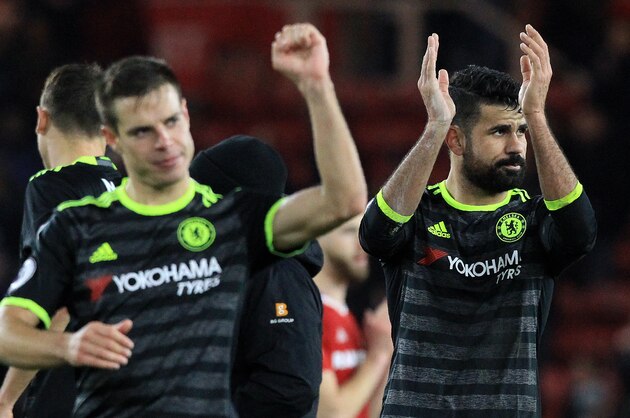 Chelsea's Brazilian-born Spanish striker Diego Costa (R) and Chelsea's Spanish defender Cesar Azpilicueta applaud the fans following the English Premier League football match between Middlesbrough and Cheslea at Riverside Stadium in Middlesbrough, northeast England on November 20, 2016.
Chelsea won the match 1-0. / AFP / Lindsey PARNABY / RESTRICTED TO EDITORIAL USE. No use with unauthorized audio, video, data, fixture lists, club/league logos or 'live' services. Online in-match use limited to 75 images, no video emulation. No use in betting, games or single club/league/player publications.  /         (Photo credit should read LINDSEY PARNABY/AFP/Getty Images)