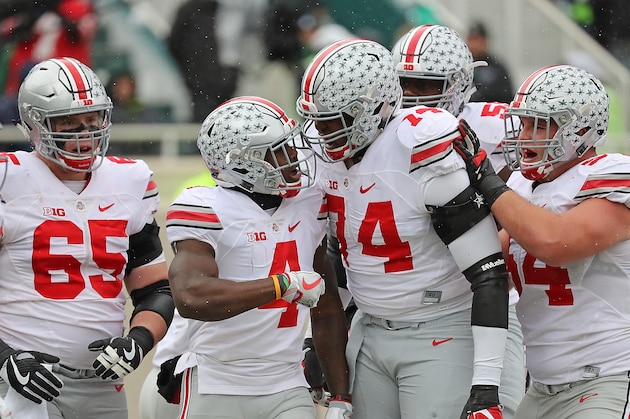 EAST LANSING, MI - NOVEMBER 19: Curtis Samuel #4 of the Ohio State Buckeyes celebrates a touchdown with his teammates during the first quarter of the game against the Michigan State Spartans  at Spartan Stadium on November 19, 2016 in East Lansing, Michigan. (Photo by Leon Halip/Getty Images)